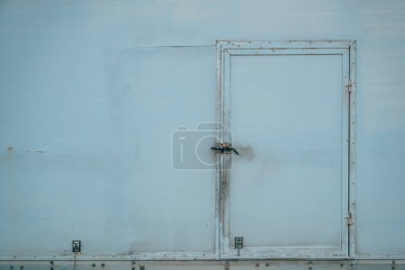 Photo for Old worn door of a refrigerated truck trailer with copy space - Royalty Free Image