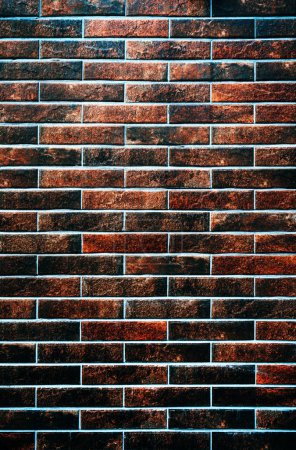 Téléchargez les photos : Texture d'un mur de briques, plan vertical de maçonnerie moderne brillant comme fond et élément de design - en image libre de droit