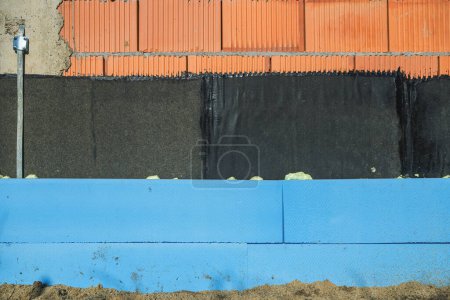 Photo for Exterior building wall with waterproofing and thermal insulation layers as construction industry background - Royalty Free Image