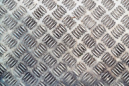 Industrial non-slip flooring diamond pattern as background, top view
