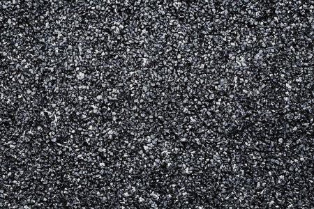 Foto de Textura negra del azulejo de goma flexible para el suelo del patio de recreo para la seguridad y la prueba de golpes, vista superior - Imagen libre de derechos