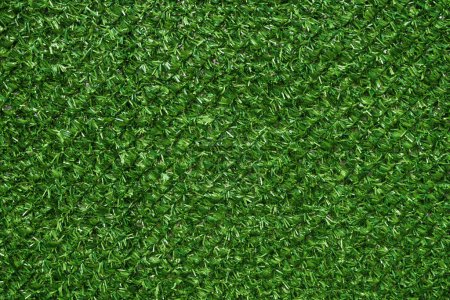 Photo for Texture of artificial green grass fencing panel as background and design element - Royalty Free Image