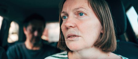 Photo for Female driver arguing with male passenger in a car, selective focus - Royalty Free Image