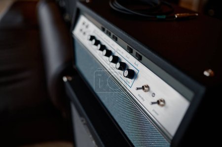 Photo for Audio sound amplifier equipment assortment at music shop showcase. Musical instrument and gear accessory display - Royalty Free Image