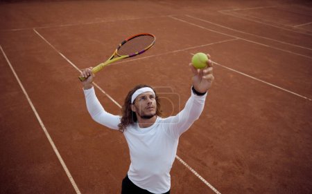Photo for High angel view on man tennis player serving ball. Sportsman ready to hit volley enjoying interesting game match - Royalty Free Image