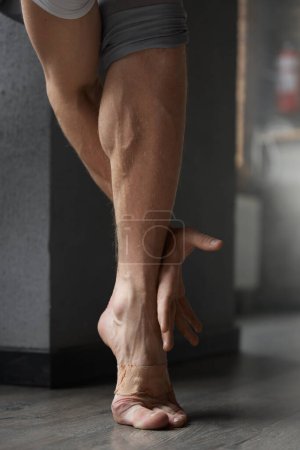 Photo for Contemporary ballet training class. Professional athletic male artist foot and arm closeup - Royalty Free Image