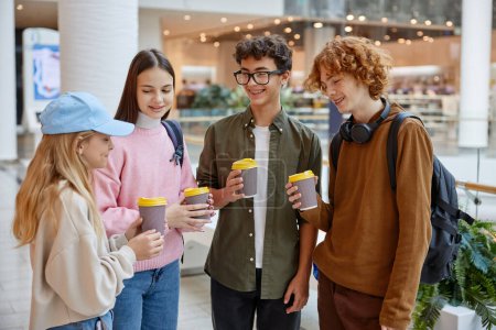 Photo for Group of happy positive children drinking coffee sharing emotion during shopping time at new supermarket or big store department. Happiness and friendship - Royalty Free Image