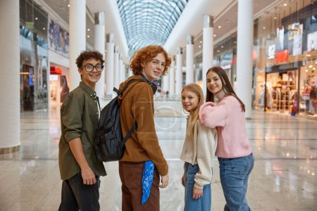 Photo for Group of young friends shopping at big city store center. Teenagers classmates walking for fun and joyful entertainment with black friday sale discount - Royalty Free Image
