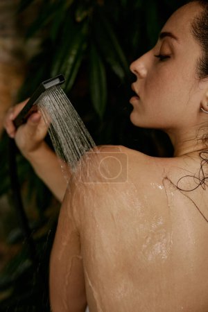 Photo for Sensual beautiful woman taking tropical shower. Hot summer and rest at exotic resort bath - Royalty Free Image