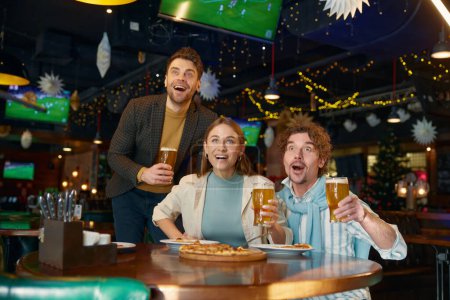 Excited friends crazy screaming shouting supporting favorite soccer team during championship match watching at sports bar