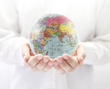 Photo for Planet Earth political globe in hands - Royalty Free Image