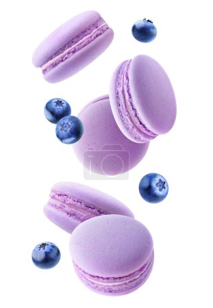 Foto de Flying macaroon cookies with fruits in the air, vertical isolated on white background - Imagen libre de derechos