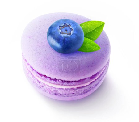 Foto de One blueberry fruit on top of macaroon isolated on white background - Imagen libre de derechos