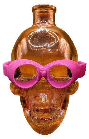Photo for Glass Human skull bottle with soft pink goggles - Royalty Free Image