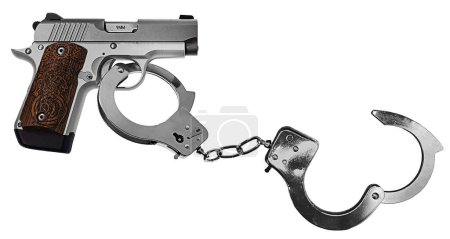 Foto de Pistola de metal plateado con empuñadura Celta Grabada con esposas - Imagen libre de derechos