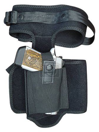 Photo for Silver metal gun with textured grip in a hip holster - Royalty Free Image