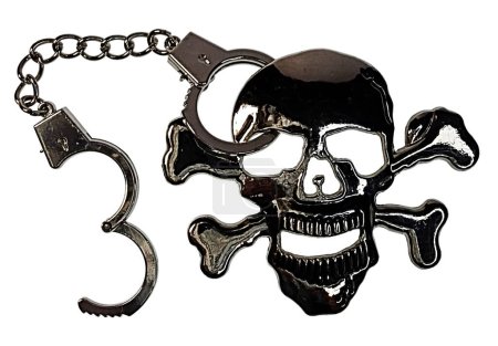 Shiny silver skull in handcuffs