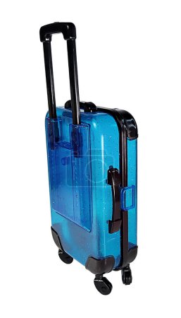 Téléchargez les photos : Une valise roulante de couleur claire utilisée pour les voyages - en image libre de droit