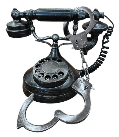 Oldtimer-Wählscheibentelefon mit Handschellen, die zeigen, dass wir an unsere Telefone gefesselt sind