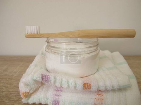 Tooth powder and a wooden toothbrush