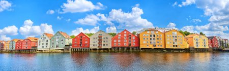 Photo for Panoramic view of old colorful wooden houses over the Nidelva river in Trondheim, Norway - Royalty Free Image