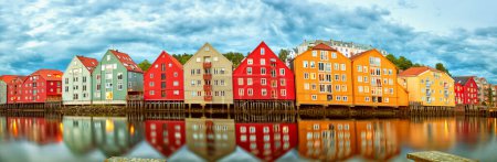 Photo for Old wooden houses over the Nidelva river at summer night in Trondheim, Norway - Royalty Free Image
