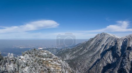 Photo for Winter scenery of the watch clouds pavilion in Lushan mountain, city in haze under pure blue sky, China - Royalty Free Image