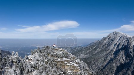 beautiful winter scenery in Mount Lu, the watch clouds pavilion against a blue sky, Lushan mountain national scenic area, China