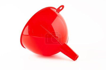 Red plastic funnel isolated on white background.