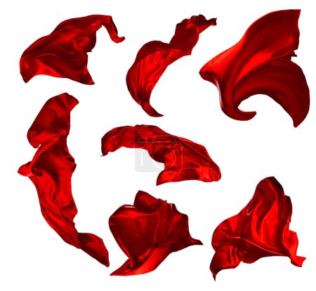 Set aus rotem Seidentuch, das in der Luft fliegt. Satin-Stoffe wehen im Wind über weißen isolierten Hintergrund. Gruppe abstrakter textiler Objekte. Schals flattern