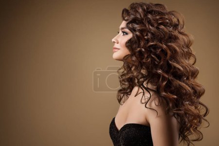 Photo for Beauty Model with Long Curly Hairstyle side view. Fashion Woman with Smooth Wavy Brown Hair. Beautiful Girl Face profile over beige - Royalty Free Image