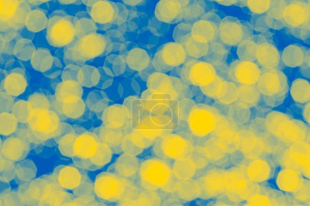 Photo for Abstract holiday backdrop: bright bokeh background colored in colors of Ukrainian flag - Royalty Free Image