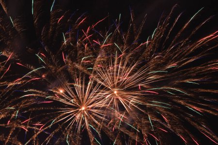 Photo for Abstract holiday background: plenty of multicolor fireworks in night sky - Royalty Free Image