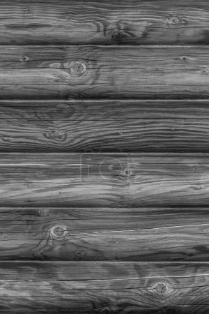 Photo for Black and white photo of dark wooden wall made of logs - Royalty Free Image