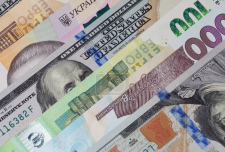Photo for Currency exchange: close up of several Ukrainian hrivnya, Euro and US dollars banknotes - Royalty Free Image