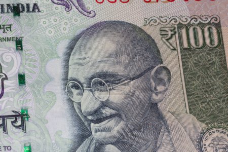 Photo for Close up of portrait of Mahatma Gandhi on one hundreed rupees banknote - Royalty Free Image