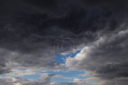 Photo for View on clearance among dark thunderstorm clouds - Royalty Free Image
