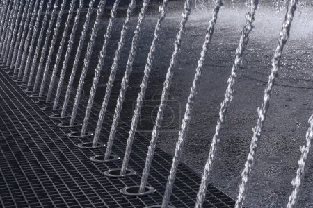 Photo for Close up of row of water jets in fountain - Royalty Free Image