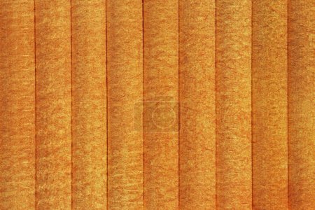 Abstract striped background: close up of orange textured wall