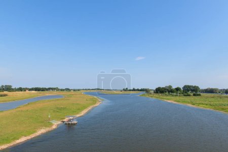 Foto de Landscape river the IJssel in Holland taken from the red bridge - Imagen libre de derechos