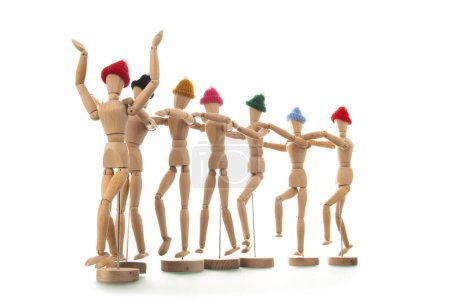 Photo for Many wooden mannequins with winter hat isolated over white - Royalty Free Image