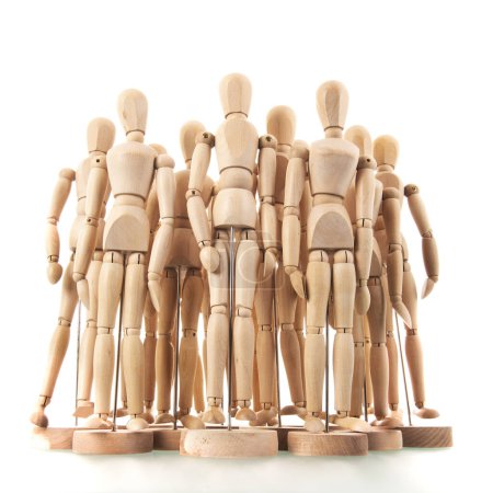 Photo for Many wooden mannequins isolated over white - Royalty Free Image