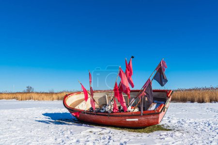 Photo for Red fishing boat on the Bodden coast in Althagen, Germany. - Royalty Free Image