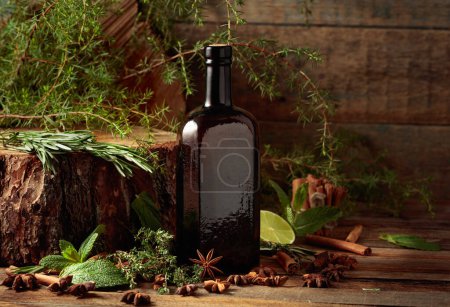 Photo for Vintage bottle and various ingredients for herbal tincture making on an old wooden table. - Royalty Free Image