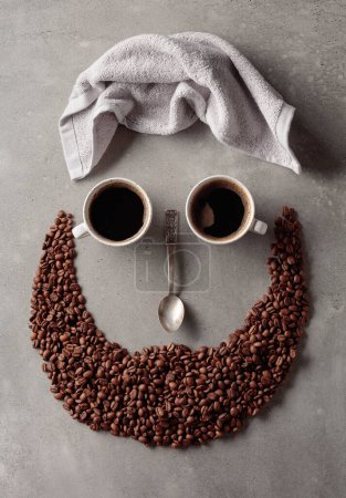 Téléchargez les photos : Coffee concept on a grey stone background. Coffee cups, towel, and spoon. The composition is like a human face. - en image libre de droit