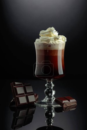 Photo for Chocolate cocktail with whipped cream on a black background. - Royalty Free Image