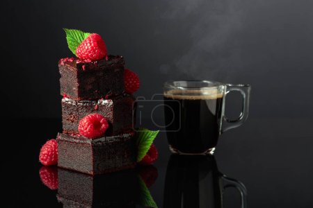 Photo for Chocolate cake with fresh raspberries and black coffee on a black reflective background. Copy space. - Royalty Free Image