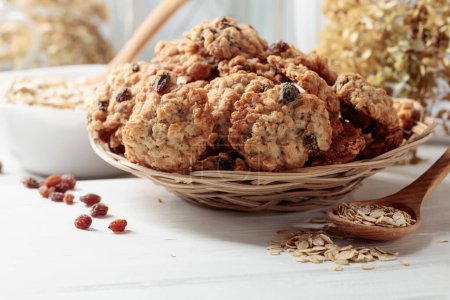 Photo for Oatmeal raisin cookies on a white table. - Royalty Free Image