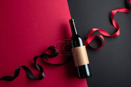 Foto de Bottle of red wine with empty label. Top view. Copy space. - Imagen libre de derechos