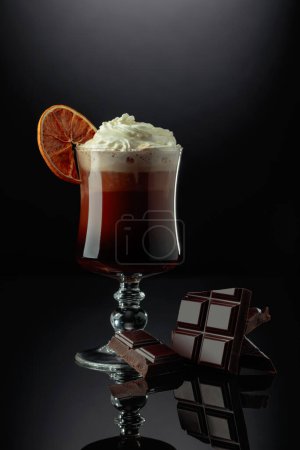 Photo for Chocolate cocktail with whipped cream garnished with a dried orange slice. - Royalty Free Image